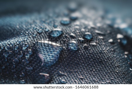 Many water drops on waterproof impregnated textile. Royalty-Free Stock Photo #1646061688