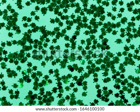Saint Patricks Day with shamrocks on green background in filled frame format 