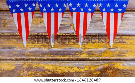 Garland of USA flags on old wood background for July 4 Independence Day