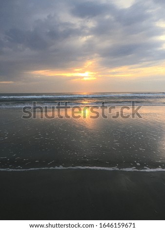 Beach Sunset with the reflection of the sun