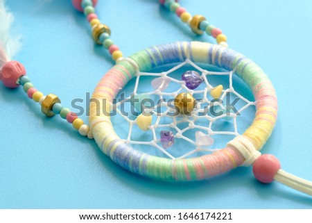 Close up of dream catchers on light blue background