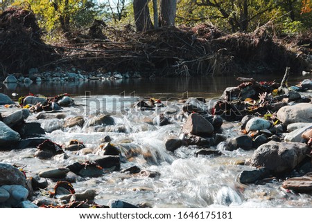 Landscape photography. Mountain river after spring ice drift. Long exposure.