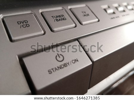 the buttons of the old technology DVD player 