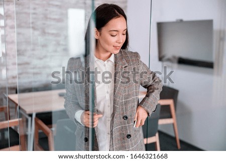 Asian woman is working in office