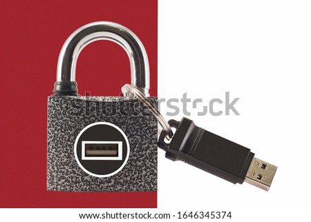 Flash drive and closed lock. Encryption and data security.