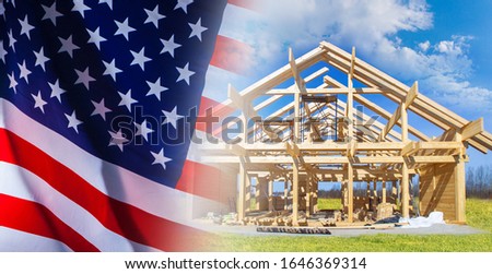 Construction business. Buying a home in America. Purchase of real estate in the United States. Wooden frame of the cottage on the background of the American flag.