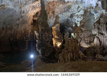 incredible scales and shapes of caves of Vietnam, stalagmites, stalactites of various shapes and sizes. river flowing in or annexed stairs give the opportunity to enjoy the whole picture of the cave