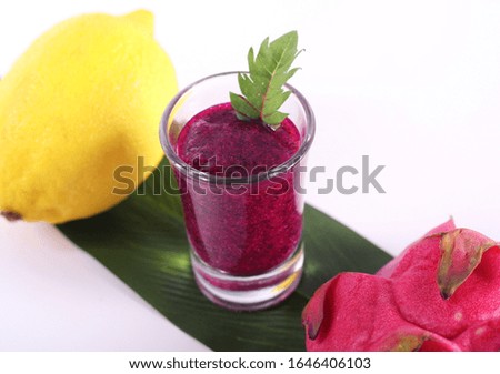 One glass of dragon fruit juice with lemon and tomato without sugar (sugar free)