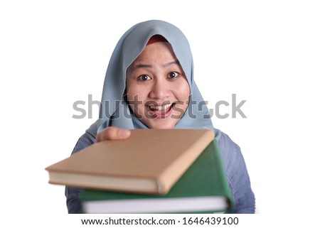 Portrait of cute friendly smiling muslim lady offering book to read