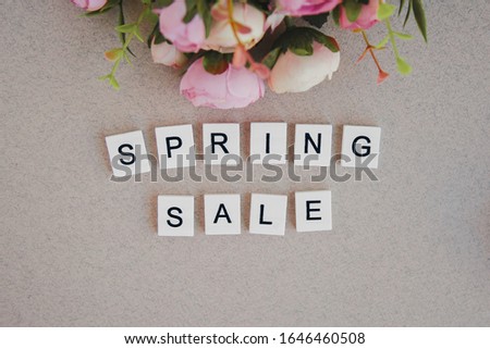 wooden lettering spring sale and spring flowers