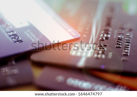 Selective macro of credit card with orange sun flare