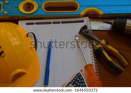 House improvement tools on oak wooden board construction concept
