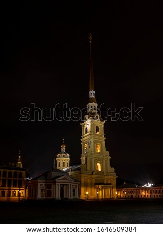 St. Petersburg. The courtyard of the Peter and Paul Fortress at night. The bell tower of the Peter and Paul Cathedral