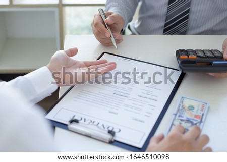  Businessmen make dollar payments while signing an investment agreement to be a partner in an illegal and successful manner, Bribery and corruption concept.
