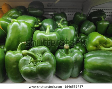 Green bell peppers in the shop for the background.