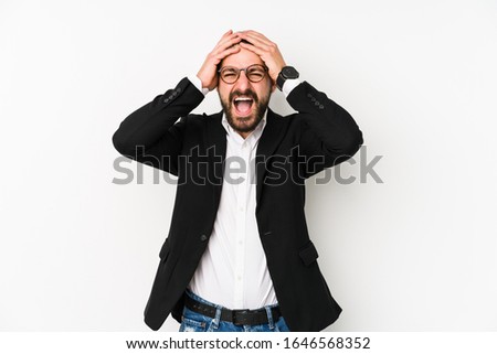 Young caucasian business man isolated on a white background laughs joyfully keeping hands on head. Happiness concept.