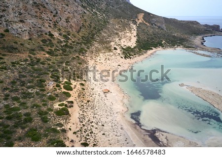 Amazing aerial drone top panoramic view on the famous Balos beach in Balos lagoon and pirate island Gramvousa. Place of the confluence of three seas. Chania. Crete island. Greece. Europe in summer