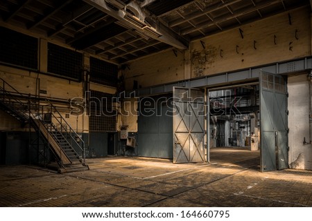 Industrial interior of an old factory Royalty-Free Stock Photo #164660795