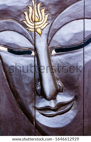 Buddha image in Thai style wood graving