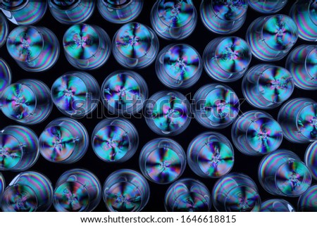 Polarised plastic items arranged on a multiplane, photographed top down Royalty-Free Stock Photo #1646618815