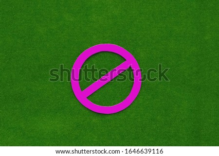 The sign is forbidden in crimson on a green background.