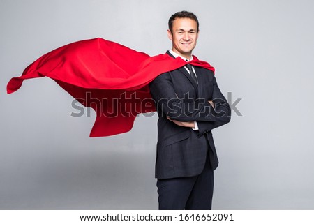 Young businessman in suit and hero cout isolated on white background