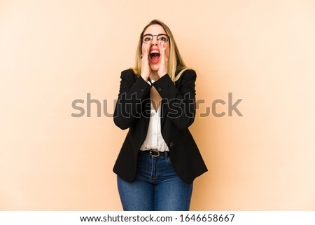 Middle age business woman isolated shouting excited to front.
