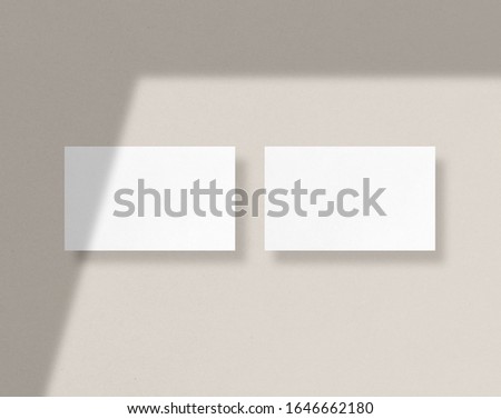 Blank white business cards mockups with shadow Overlays. Mockup scene. Photo mockup with clipping path.