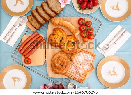 Breakfast Served buffet in the morning with cereal, raisin, banana, sausage bread, chicken sausage, Natural corn flake breakfast cereal in cups and coffee, fruit prepared On the table every day
