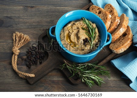 Cream souffle 'Babaganush' eggplant in a blue plate on a dark background Royalty-Free Stock Photo #1646730169