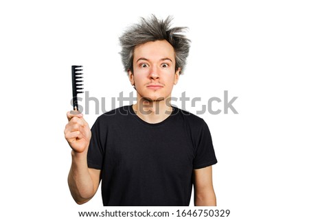 long hair grey guy hold comb on a white isolated background.