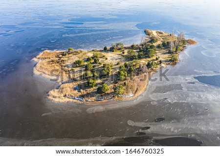 Winter Islands at frozen Vileyka Reservoir in Belarus