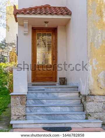 marble stairs to elegant family house entrance natural wood door