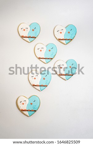 Six heart-shaped decorated sugar cookies
