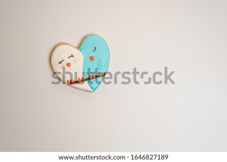 One heart-shaped decorated sugar cookie