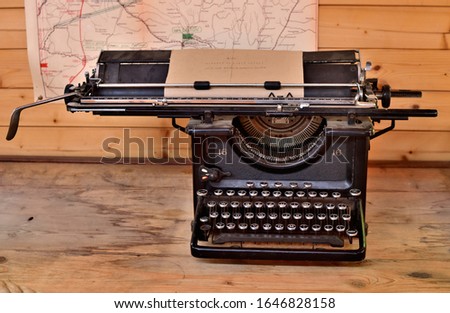 Old antique typewriter from first world war in grunge looks on a wooden table
