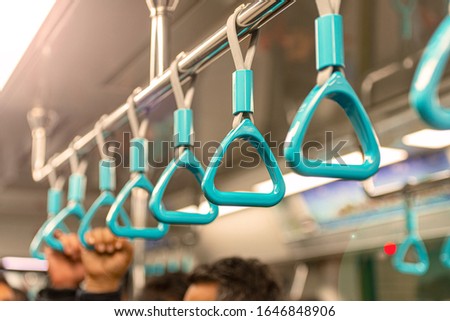 Close-up Subway or Metro Handrail, Hand holding blue Handrail Royalty-Free Stock Photo #1646848906
