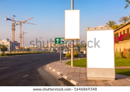 Advertisement mockup. Blank empty billboards on the city street in Dubai, UAE.