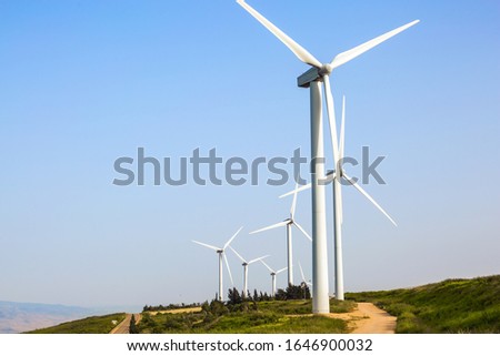Modern equipment for generating electric energy. Israel. Modern windmills. Wind generator - wind farm on Mount Gilboa. The concept of environmental protection and photo tourism 