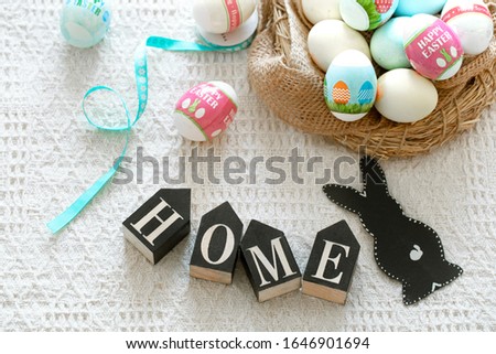 happy Easter . Beautiful Easter composition with colorful eggs and a paper Hare.