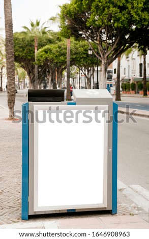 Blank electronic advertising poster with blank space screen for your text message or promotional content, clear banner in urban setting, empty poster at a bus stop, public information billboard

