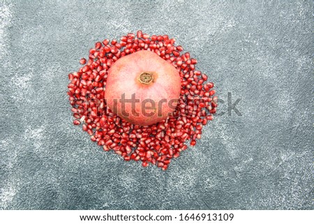 Pomegranate, pomegranate background, pomegranate juice, vitamins, fruits, fruit background, bunches of pomegranate, ripe fruit, diet food, healthy food, red background, abstract background