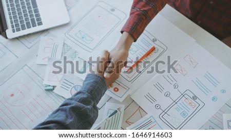 Designers man drawing (UX) (UI) Graphic designer creative sketch planning application process development prototype for application on smartphone