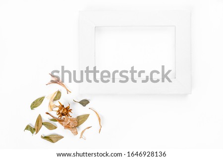Flowers and photo frame composition on white background. spring concept. Flat lay, top view, copy space