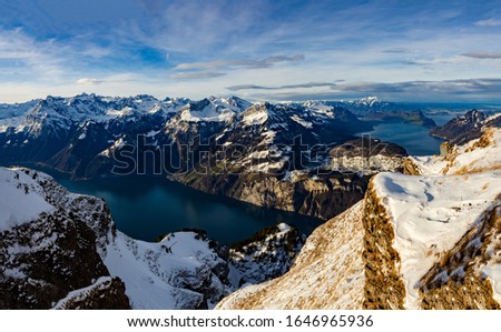 Pictures of snow-capped mountains with a view of the lake and mountain front