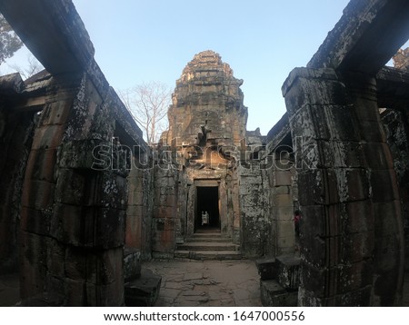wide angle picture of temple ruins of angkor wat, with ancient door and tower, cambodia