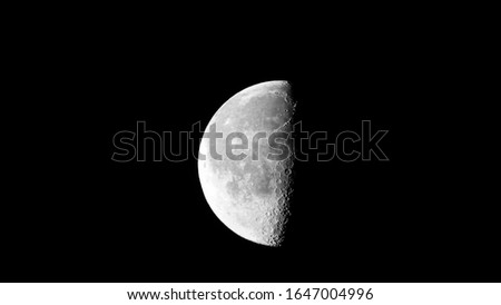 photograph taken of a half moon. photo was taken in the state of Tennessee, USA.  was taken freehand without a tripod. I have plenty of moon photos ranging from new moon to full moon. check them out