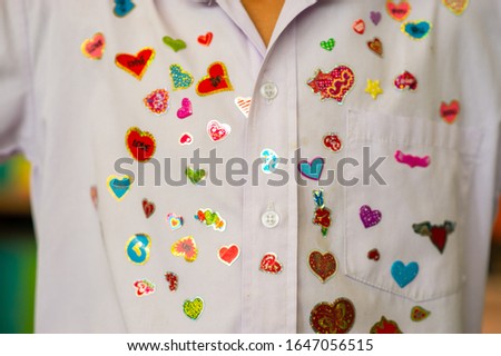 He received a heart-shaped sticker on Valentine's Day. Royalty-Free Stock Photo #1647056515