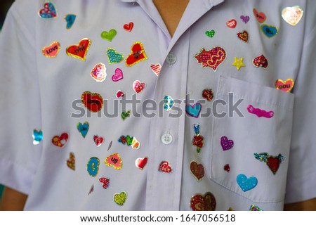 He received a heart-shaped sticker on Valentine's Day. Royalty-Free Stock Photo #1647056518