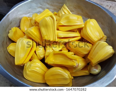 Ripe jackfruit that removes the pellets background, Jackfruit is the sweet and delicious fruit of Thailand. Tropical fruit, Fresh Jackfruit on wooden table. Asian fruit concept.Soft focus,Select focus Royalty-Free Stock Photo #1647070282